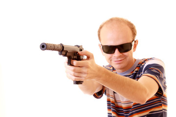 Fototapeta na wymiar Young man aiming with gun isolated