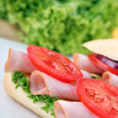 Sandwich with fresh vegetables, ham and cheese
