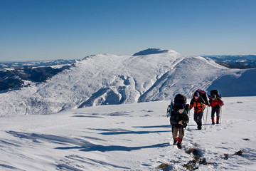 Hiker are in winter in mountains