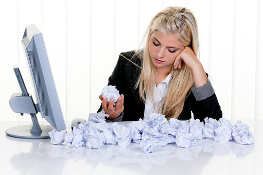 Woman with paper searches for ideas