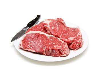 Plate of Steaks and Knife