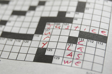 closeup if a crossword puzzle with legal terms
