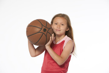 Little girl holding basketball