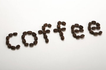 the word coffee written with coffee beans