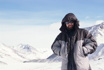 Fototapeta na wymiar Alpinist in winter mountain