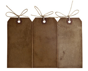 three different grunge paper tags with bow string, isolated on w
