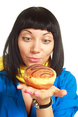 girl eating a roll with chocolate