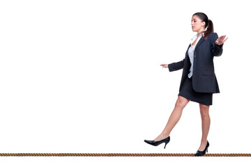 Businesswoman walking a tightrope isolated on white. - obrazy, fototapety, plakaty
