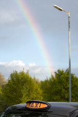 London Black Taxi Cab and Rainbow