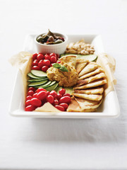 naan bread, cherry tomatoes, cucumber, olives and almonds