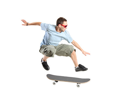 A skateboarder jumping isolated on a white background