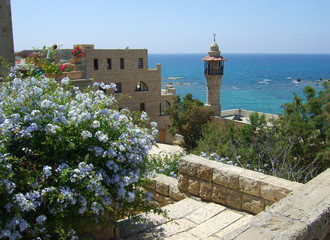 Beautiful lighthouse before blue-green water