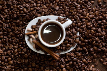 Naklejka premium Cup of coffee with chocolate view from above