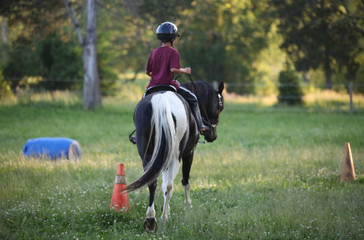 child riding horse