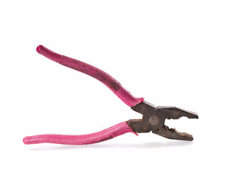 Old and rusty pliers with pink aged handlers