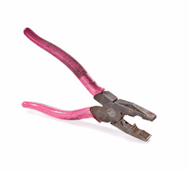 Old and rusty pliers with pink aged handlers