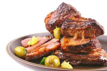 rib's and green olives on dish side view
