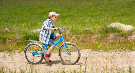 Fototapeta na wymiar Boy with bike