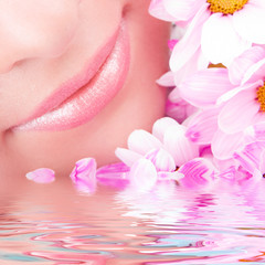 Smile of young woman with flowers