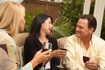 Three Friends Enjoying Wine on the Patio