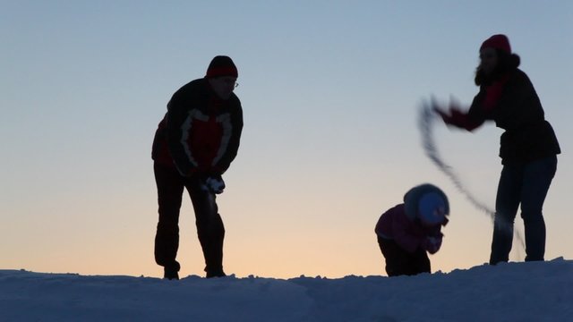 The Silhouette Family Play With Snow