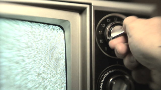 Turning channel knob on retro television stuck on static