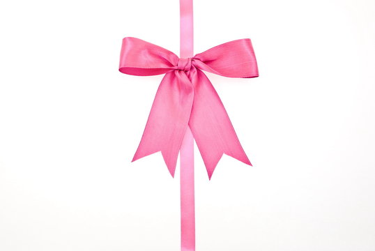 Gift packaging with pink ribbons and bow isolated on white