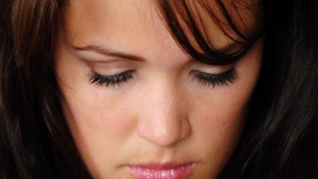 HD720p Young sexy brunnete woman looking on green background