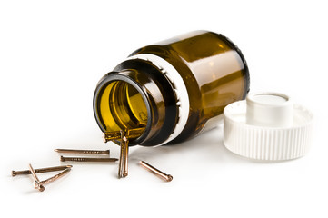 copper nails in a small jar isolated on white