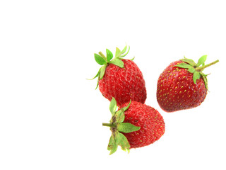Isolated fruits -  three strawberries on white background.