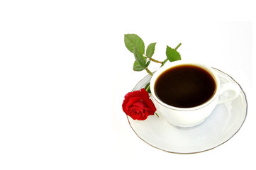 Cup of coffee and small red rose isolated over white with space