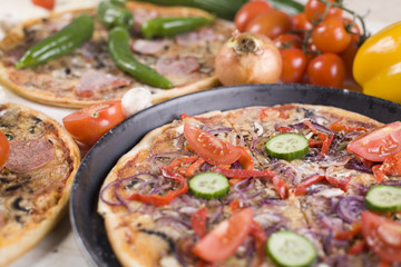 Vegetables with a pizza