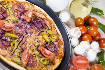 Fresh vegetables with a pizza