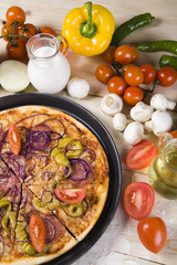 Vegetables with a pizza