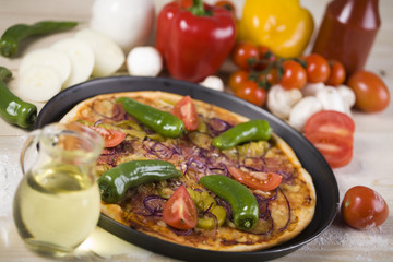Fresh vegetables with a pizza