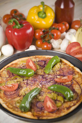 Fresh vegetables with a pizza