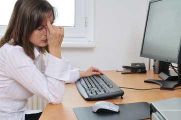 Tired business person with headache in work
