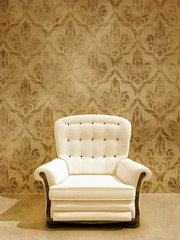 White seat on damasque wall