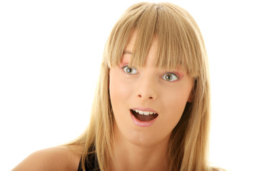 Naklejka premium Face of a young shocked woman. Close up