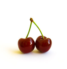 two berries of ripe cherry on a white background