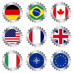 Cogwheels with flags isolated over white background