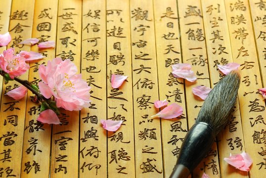 Fototapeta Pink Flowers and Brush on Chinese ancient bamboo slips