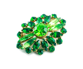 A green brooch isolated