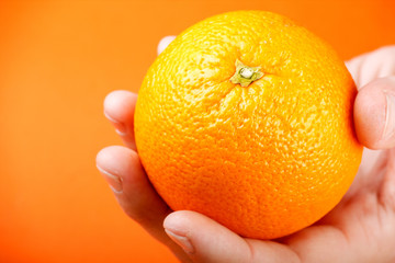 orange on a hand