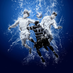 Water drops around football players under water