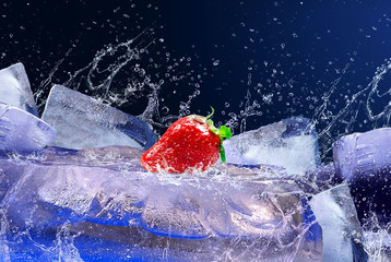 Water drops around strawberry on the ice