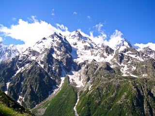 High mountains with snow in summer