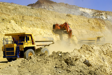 Loading of dump-body trucks in career