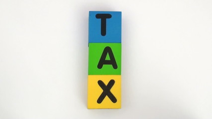 Alphabet blocks spell out TAX series - HD
