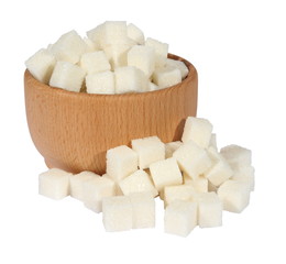 Lump sugar in a wooden mortar on a white background